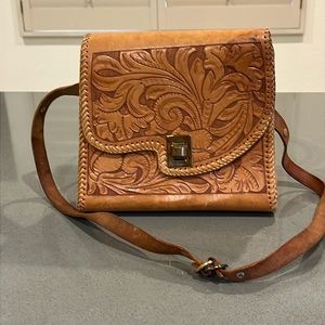 Vintage hand tooled leather handbag/purse with floral design.